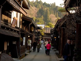 Whole streets are lined with the historic wooden buildings that usually host little shops selling local products like miso paste or sake in particular. There is a lot of sampling going on, you should definitely try!