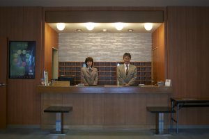 The hotel manager, Toshiro Nagahama, and his lovely front desk colleague&nbsp;