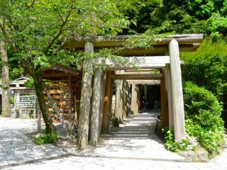 These series of wooden torii gates on the other end of a tunnel carved into the hill mark the entrance to the Zeniarai Benzaiten Temple.