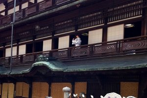 The rippling pool motif of Dogo onsen appears on the balustrades and the bathrobes