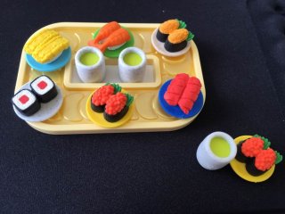 A sushi-go-round style set including 2 cups of green tea and 6 plates of sushi. They are so tiny, but you can still separate the rice and toppings on each one!