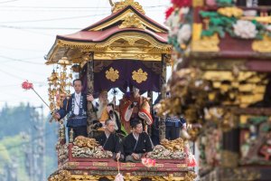 The floats roll their way through the streets of Yatsuo