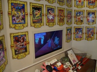 The wall of Shin-chan, an ode to the 23 Crayon Shin-chan films with a display case of &quot;props&quot; underneath.&nbsp;
