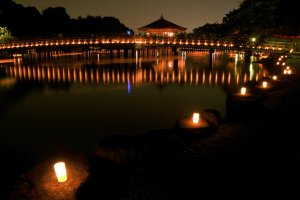 Lanterns from the Tokae and boats reflected in a pond in Nara Park