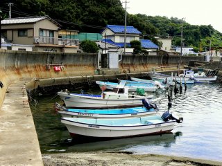 Boats moored along the sea wall