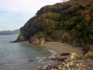 A small, secluded beach. You can see Shido Bay far in the distance to the left