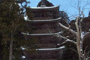 Matching five story pagodas decorate Dewa Sanzan. One marks the footpath to a mile of 2,446 stairs to the top of Mt. Haguro.