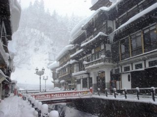 Snow piles up high in winter at Ginzan Onsen