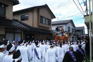 The mikoshi shrine being carried throughout town. 