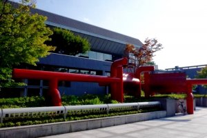 The red sculpture whose design is inspired by the shrine torii gates nearby