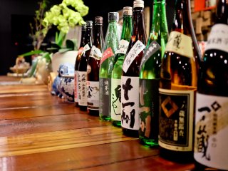 The counter is decorated with various Sake bottles in true Japanese style