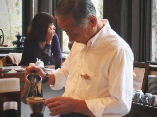 The barista will then gently pour scalding water over the grounded coffee powder to create a delicious drip coffee.