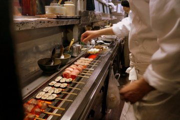 <p>Chef Suzuki at work. An electric grill, he explains, provide much more even heat.</p>