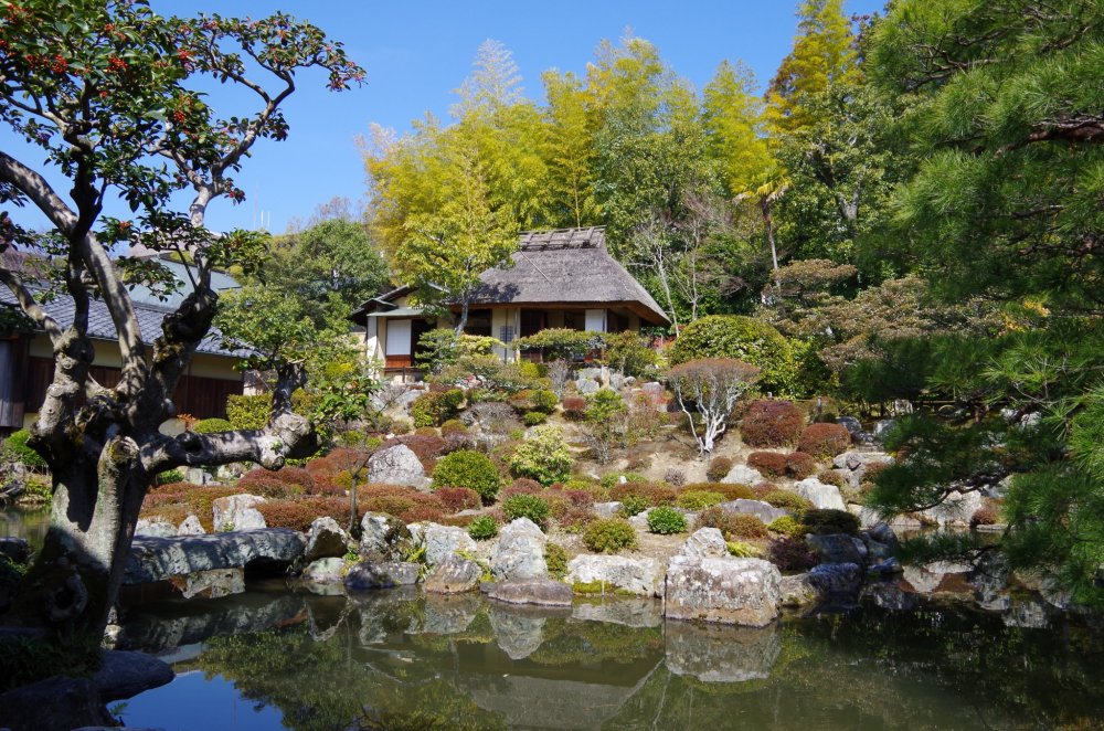 A teahouse and pond in the west garden, viewed from behind the main building