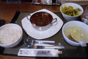 Gyutan stew, served with the traditional barley rice and ox tail soup, as well as a salad.
