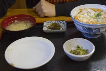 <p>Oyako-don teishoku: a rice bowl topped with chicken and egg, served with vegetables, pickles, and miso soup</p>