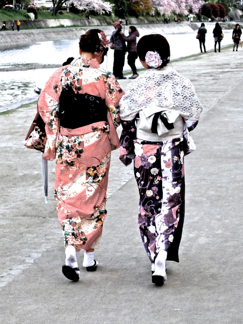 <p>Woman enjoying an evening stroll in kimono</p>