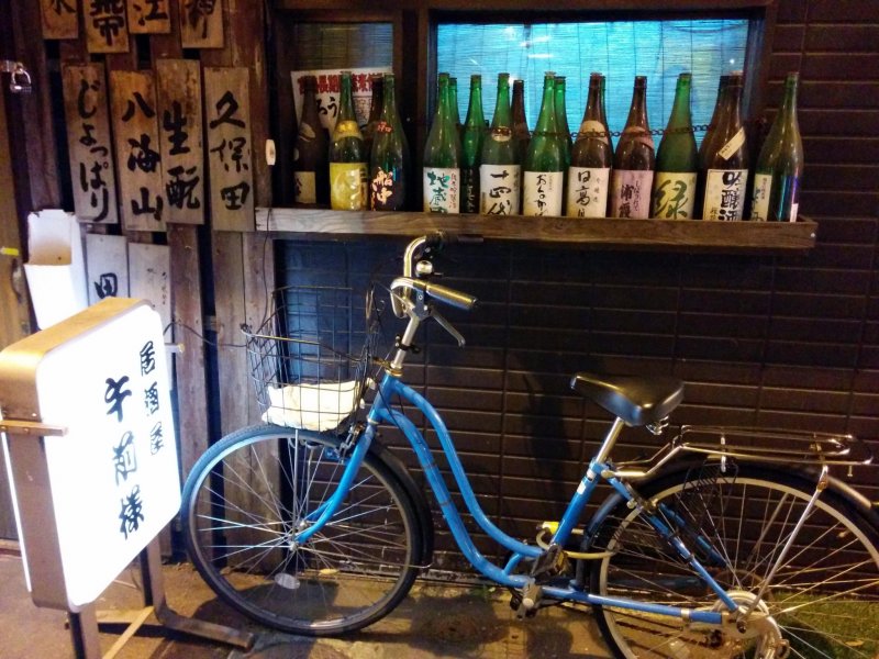 <p>A local parks his bike in front of his favorite bar. The ride here was easy, but he will be walking his bike home because of the zero tolerance on alcohol law when operating a vehicle in Japan.&nbsp;</p>