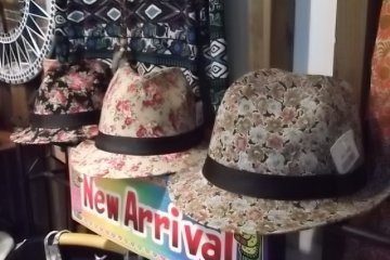<p>They also sell clothing such as dresses, sarongs, and these hats</p>