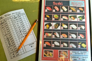 <p>Sushi is very simple to order. Refer to the number on the picture menu and the number on the blank order sheet available at each table.</p>