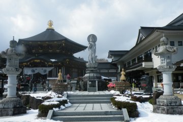 <p>The Amida Buddha Scroll is kept at the main temple (to the left). The Kannon statue for children is at the centre.</p>