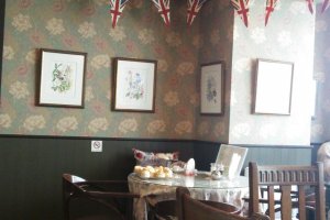 Union Flag bunting, patterned wallpaper and antique furniture all add to the great atmosphere here