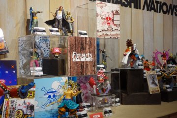 One Piece figurines display nearby the Amusement Arena