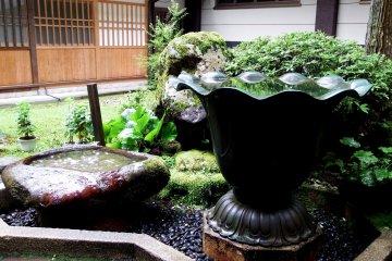 <p>Water basins standing in front of Kichijōkaku Hall</p>