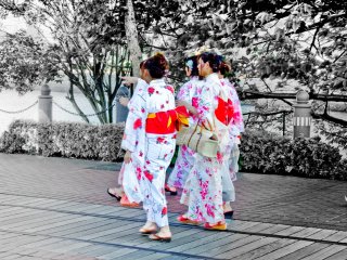 A group of young women wearing some very bright and beautifully colored Yukata (Summer Kimono)