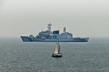 <p>Keeping a watchful eye! The Japan Coast Guard lurking in the distance</p>