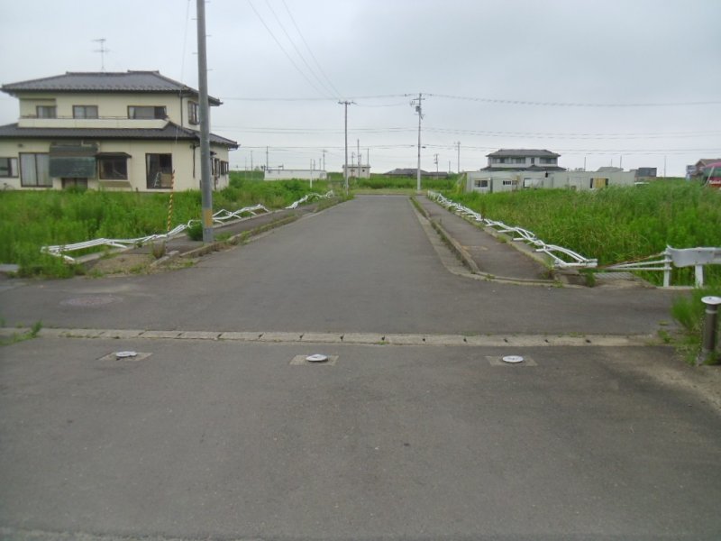 <p>The guardrails on the road leading to the junior high school were flattened - not by the tsunami, but by a house that was carried away in it.</p>