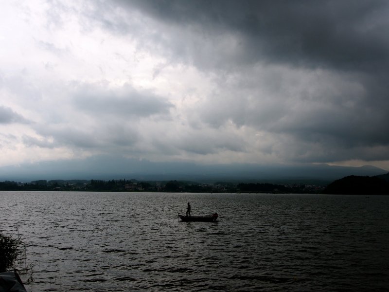 <p>A lone fisherman on Lake Kawaguchi</p>