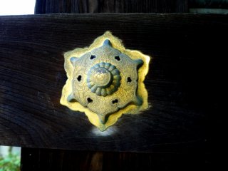 Ornate gold stud on the gate