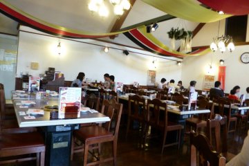 <p>Each table is equipped with it&#39;s own area to cook your own meat. There is a summer patio set up on sunny days in summer, but the interior ensures that you&#39;ll never get rained on!</p>
