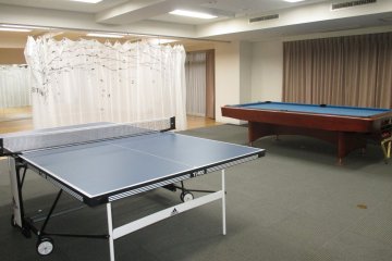 <p>Feel free to play pool or ping pong all night long</p>