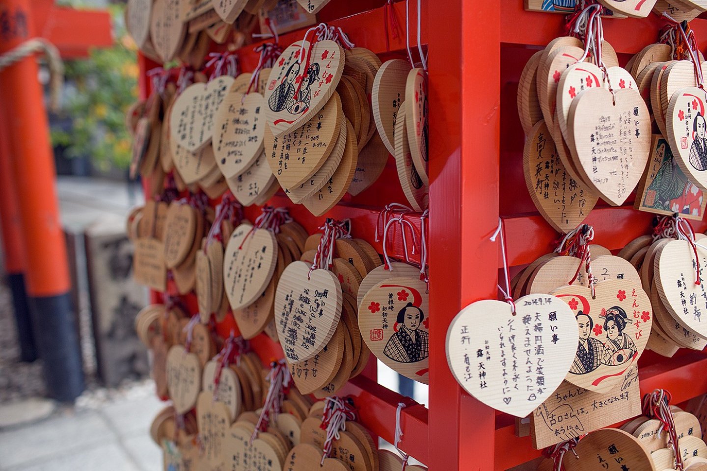 These heart-shaped 'ema' (wooden boards where wishes are written), depict Ohatsu and Tokubei and hang in memory of their story