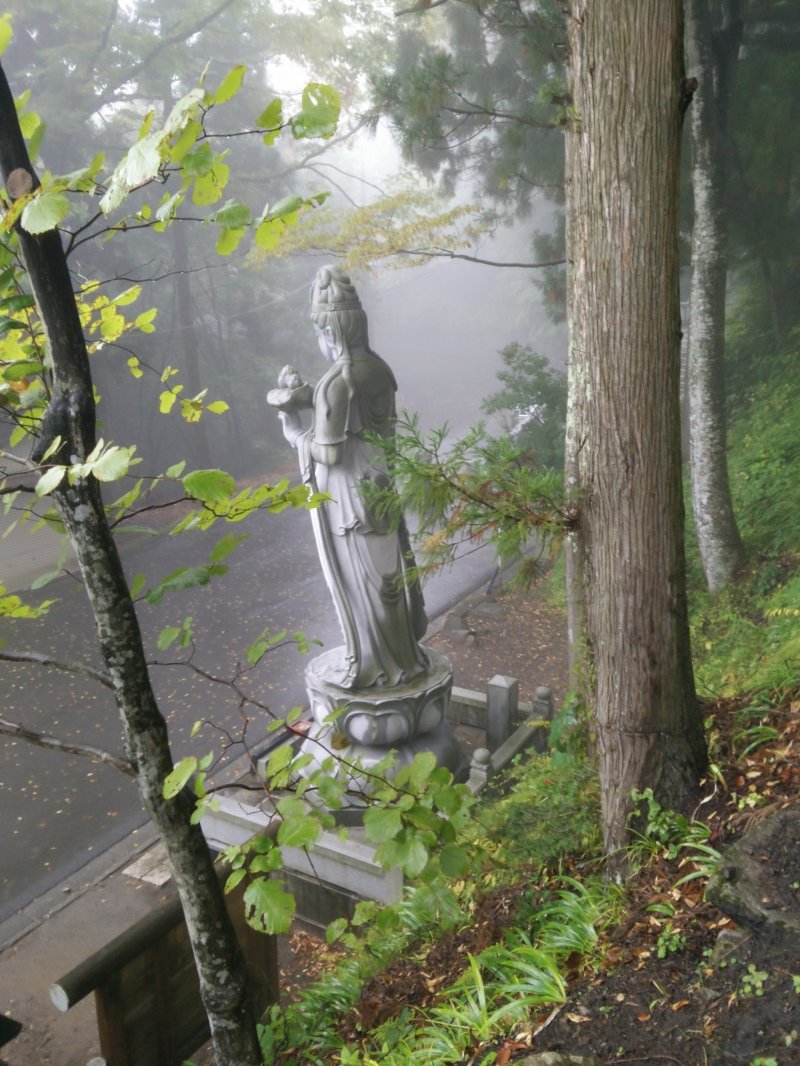 <p>A large statue greets you as you finally reach the top of the access road</p>