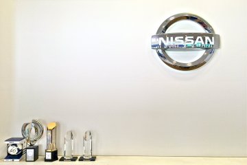 <p>Nissan logo and their prestigious awards inside the Guest Hall</p>