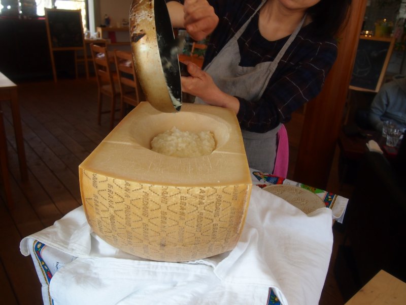 <p>This is their statement dish - Cheese risotto finished off inside the half wheel of Parmigiano</p>