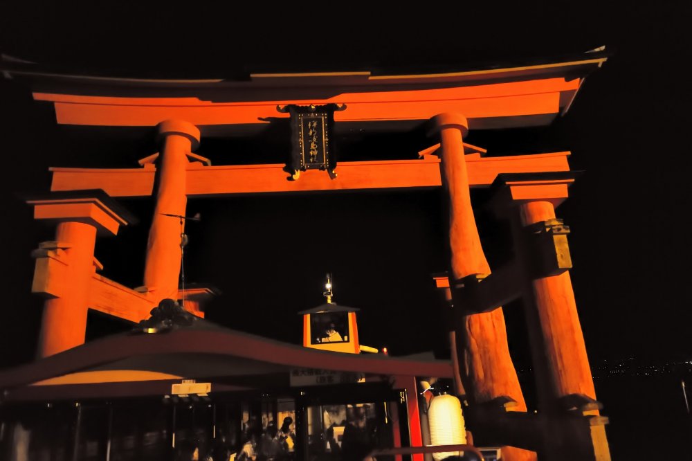 My boat passing through the torii gate which towers over it as we get closer