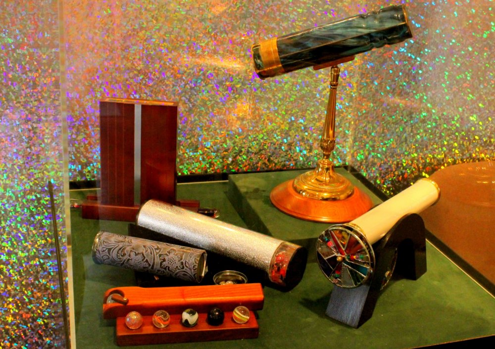 Glass-encased, hand-made kaleidoscopes and their accessories