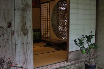 <p>A peek inside the left open shoji paper door towards the interior</p>