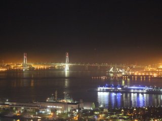 Night view from &#39;see through&#39; gondola - photo taken during the ride - Close up of Bay Bridge