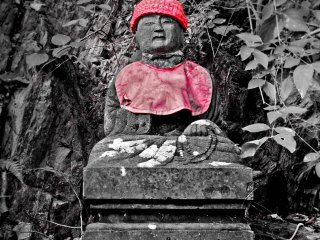 Although Jizo are believed to protect virtually any &lsquo;good person&rsquo;, you will see many of them decorated in red hats or bibs emphasizing the fact that many worshippers wish for this power of protection to be brought upon their offspring