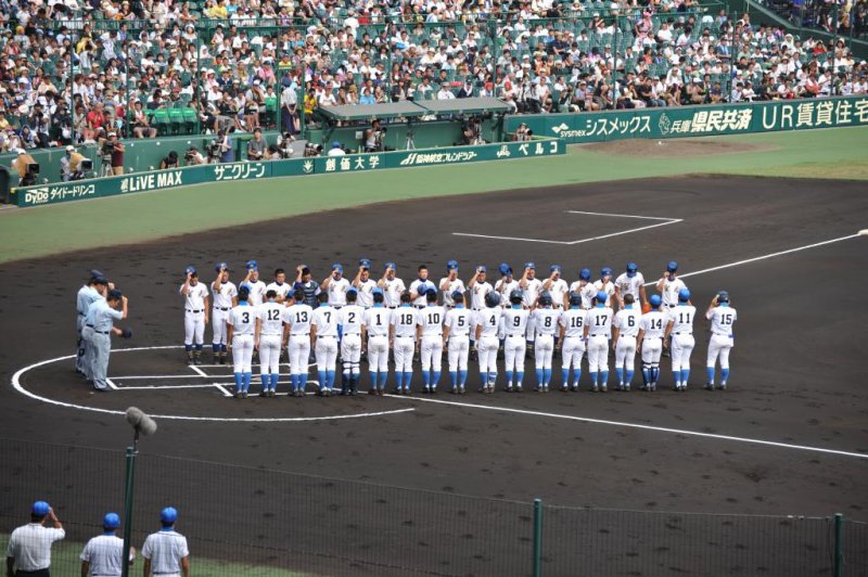 The teams line up and bow to each other before the game begins.