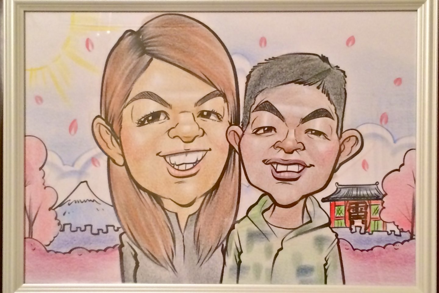 The finished product. Our caricature selection was a Quick Type in Color, with Background and Framed. We love it!