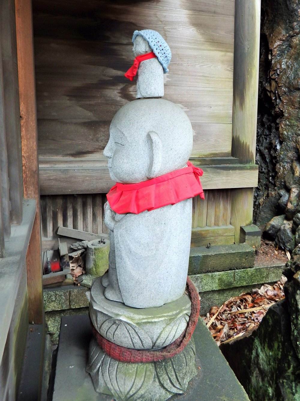 If you peer in from the side, the Jizo has another tiny Jizo&nbsp;balancing on his head!