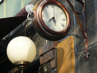 The clock near the cafe resembles a regular station clock