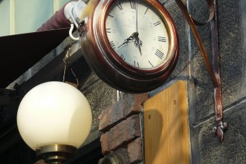 <p>The clock near the cafe resembles a regular station clock</p>