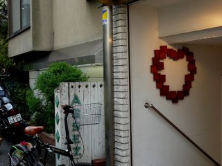 This pretty heart is hanging at the entrance of a beauty salon